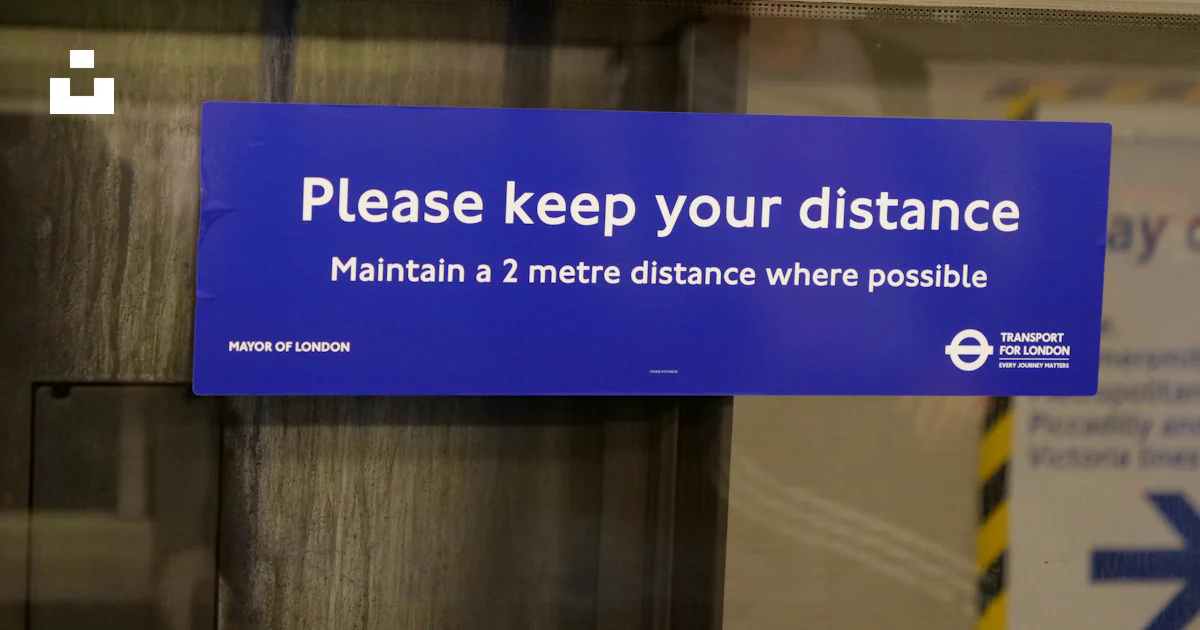 A blue sign that says please keep your distance photo – Free Uk Image ...