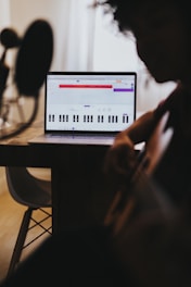 person using computer on table
