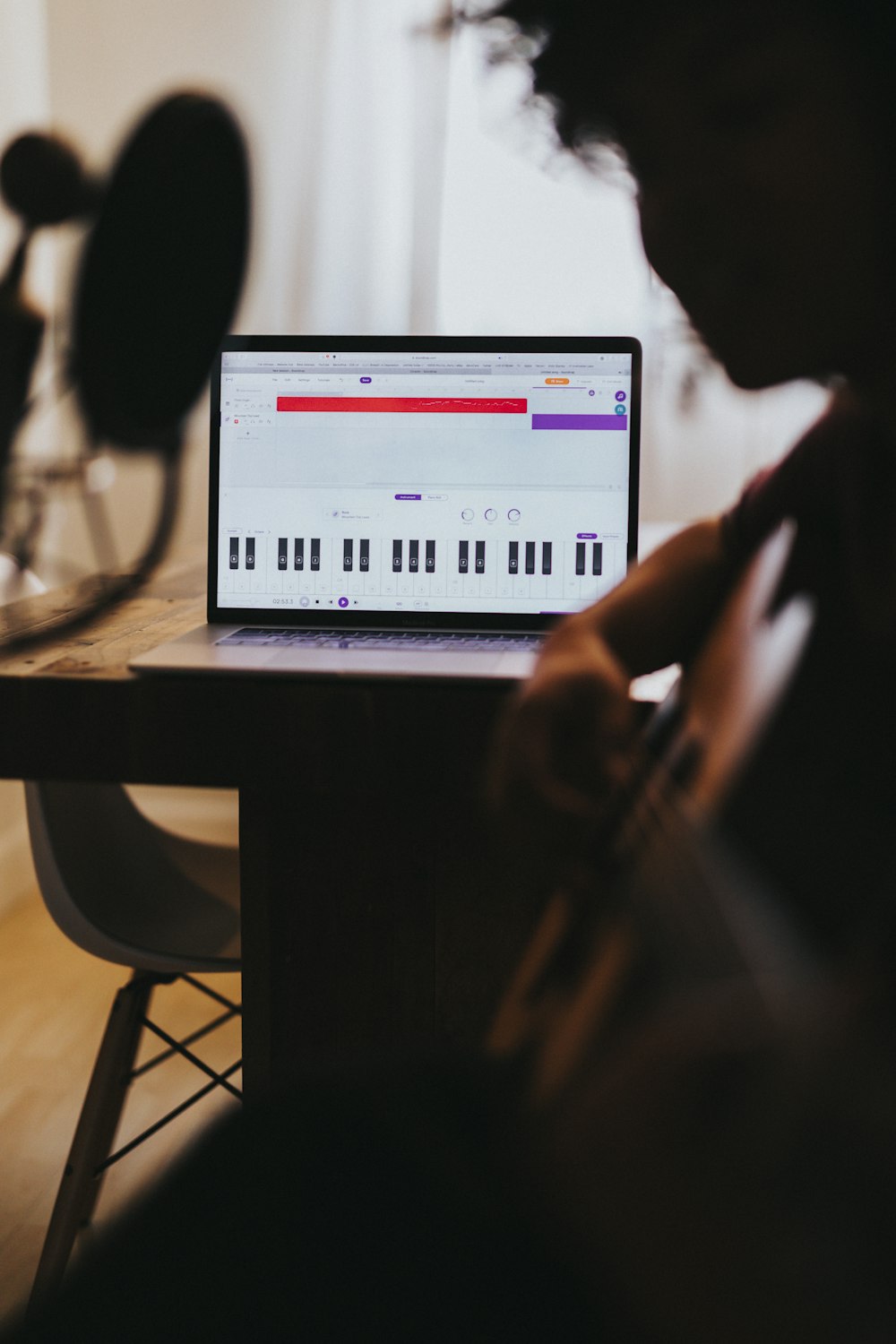 person using computer on table