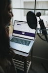 macbook pro on white table