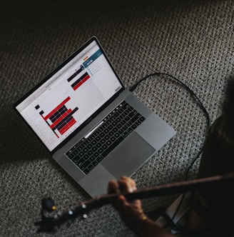 macbook pro on gray carpet