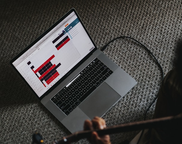 macbook pro on gray carpet