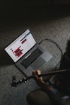 macbook pro on gray carpet