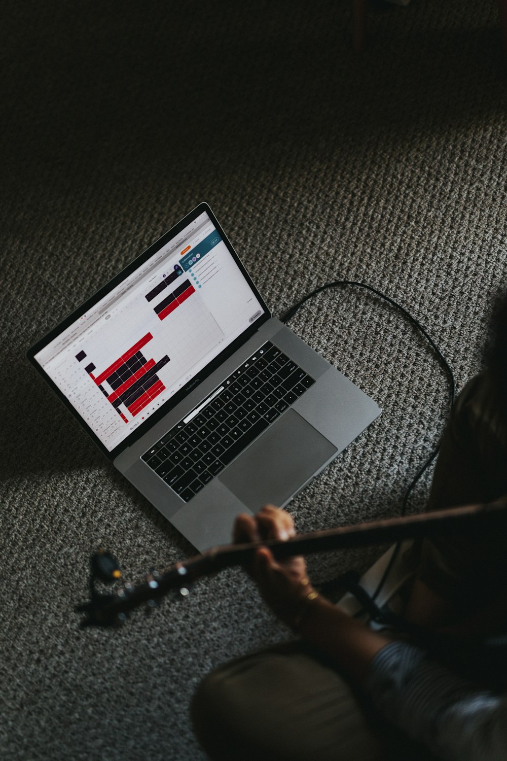 macbook pro on gray carpet