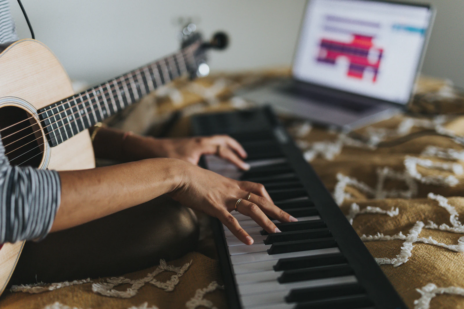 A learner practising at a keyboard at home