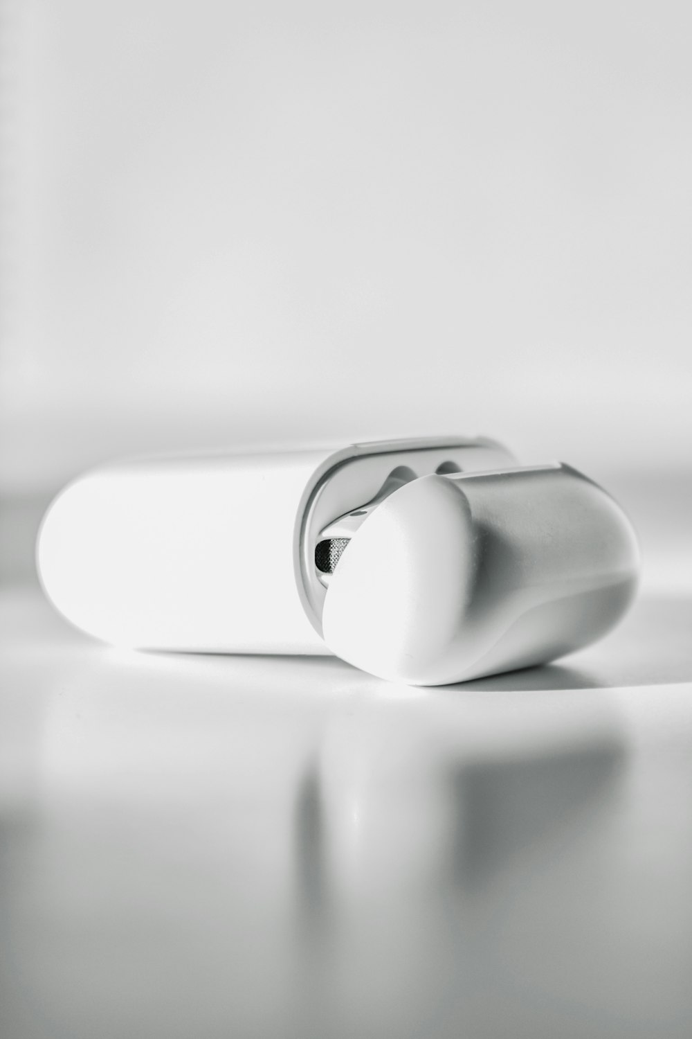 white ceramic mug on white table