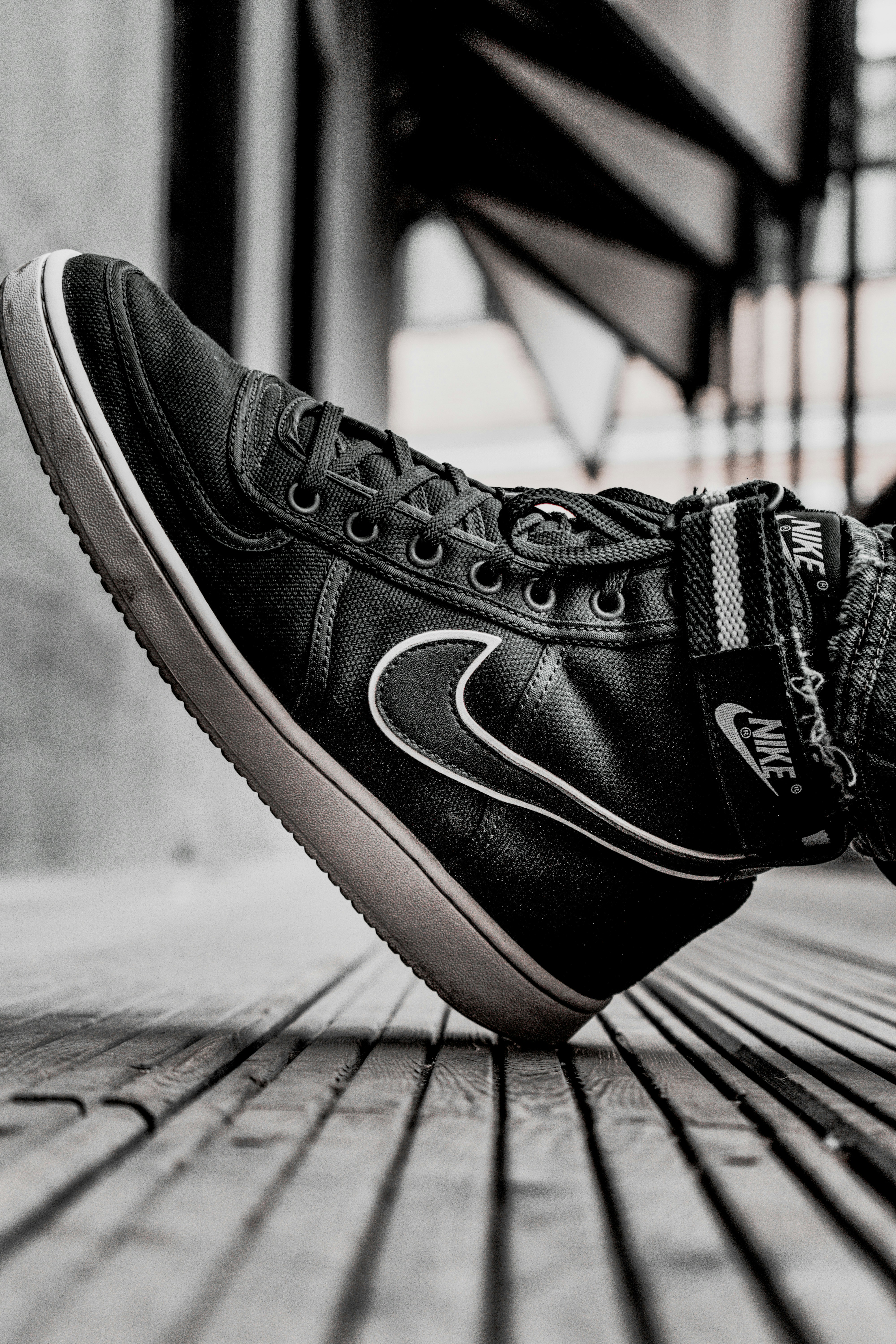 black and orange nike high tops