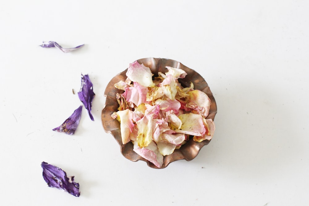 purple and white flower petals on white surface