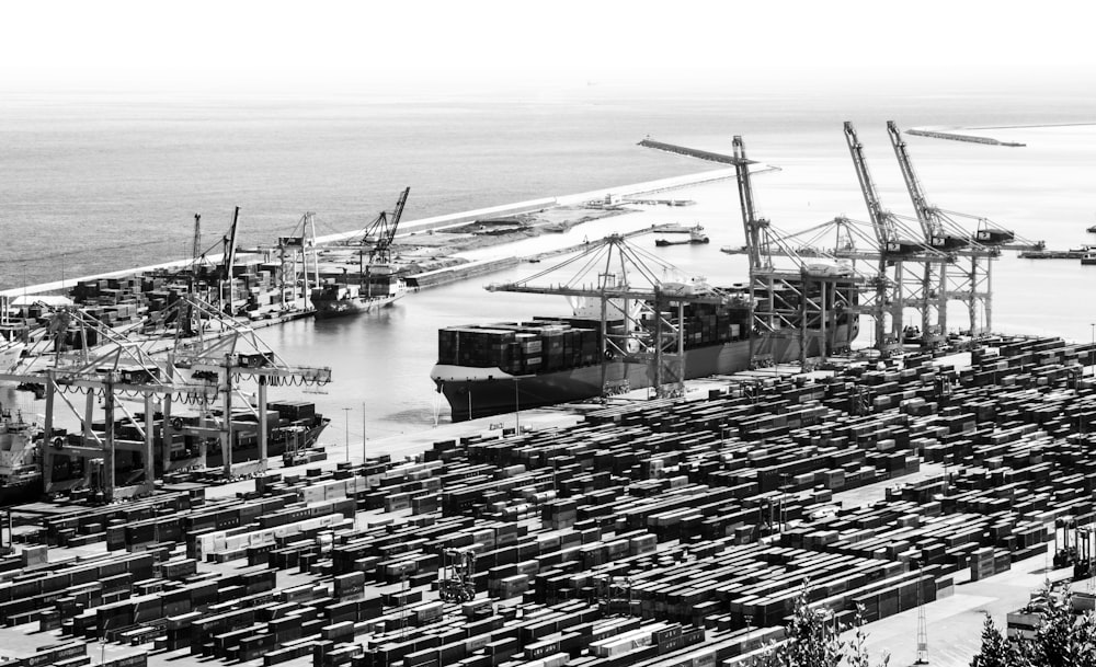 grayscale photo of cargo ship on sea