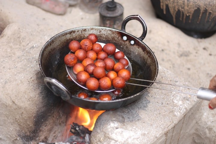 Roshogolla -- sweet dough balls.