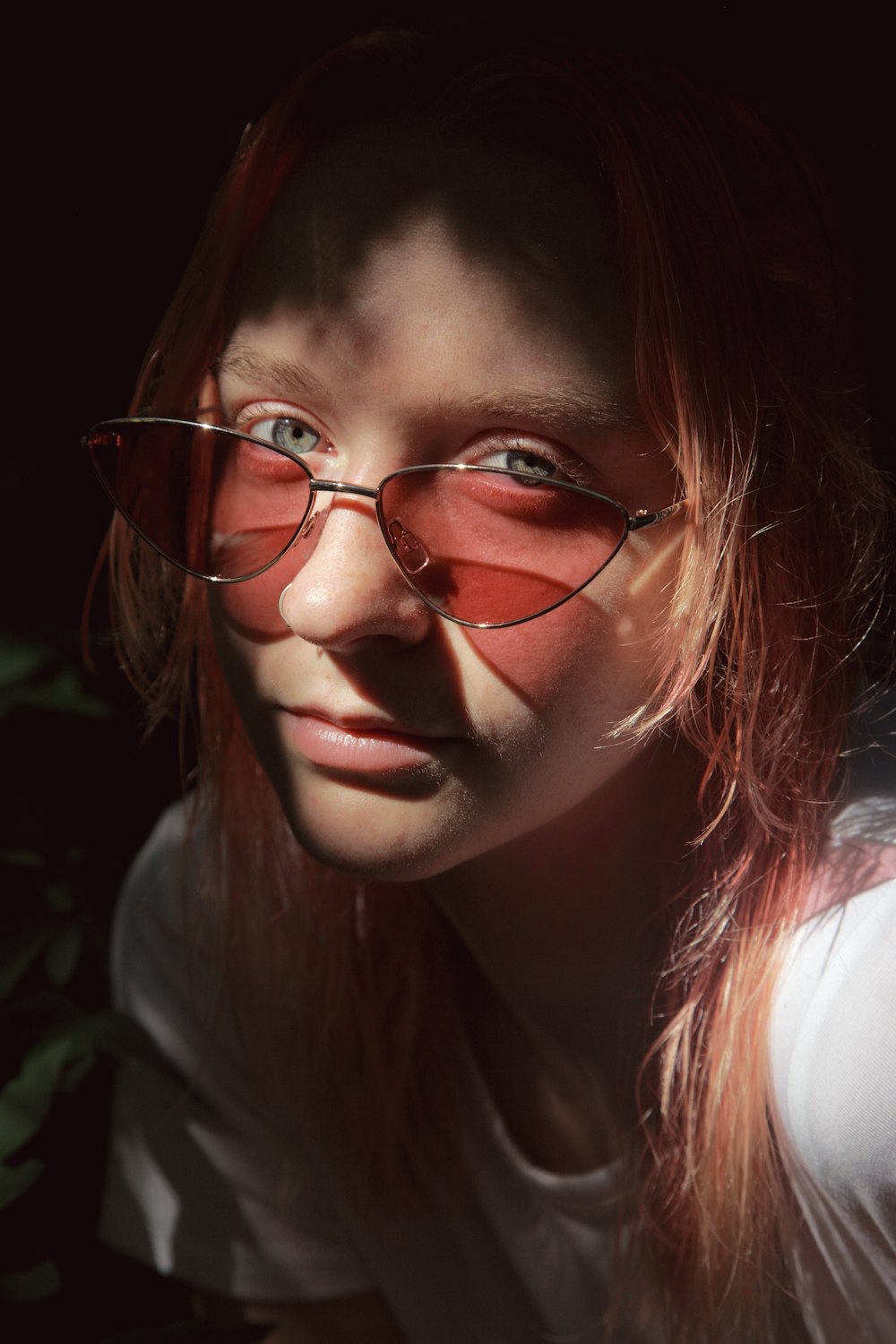 woman in white shirt wearing eyeglasses