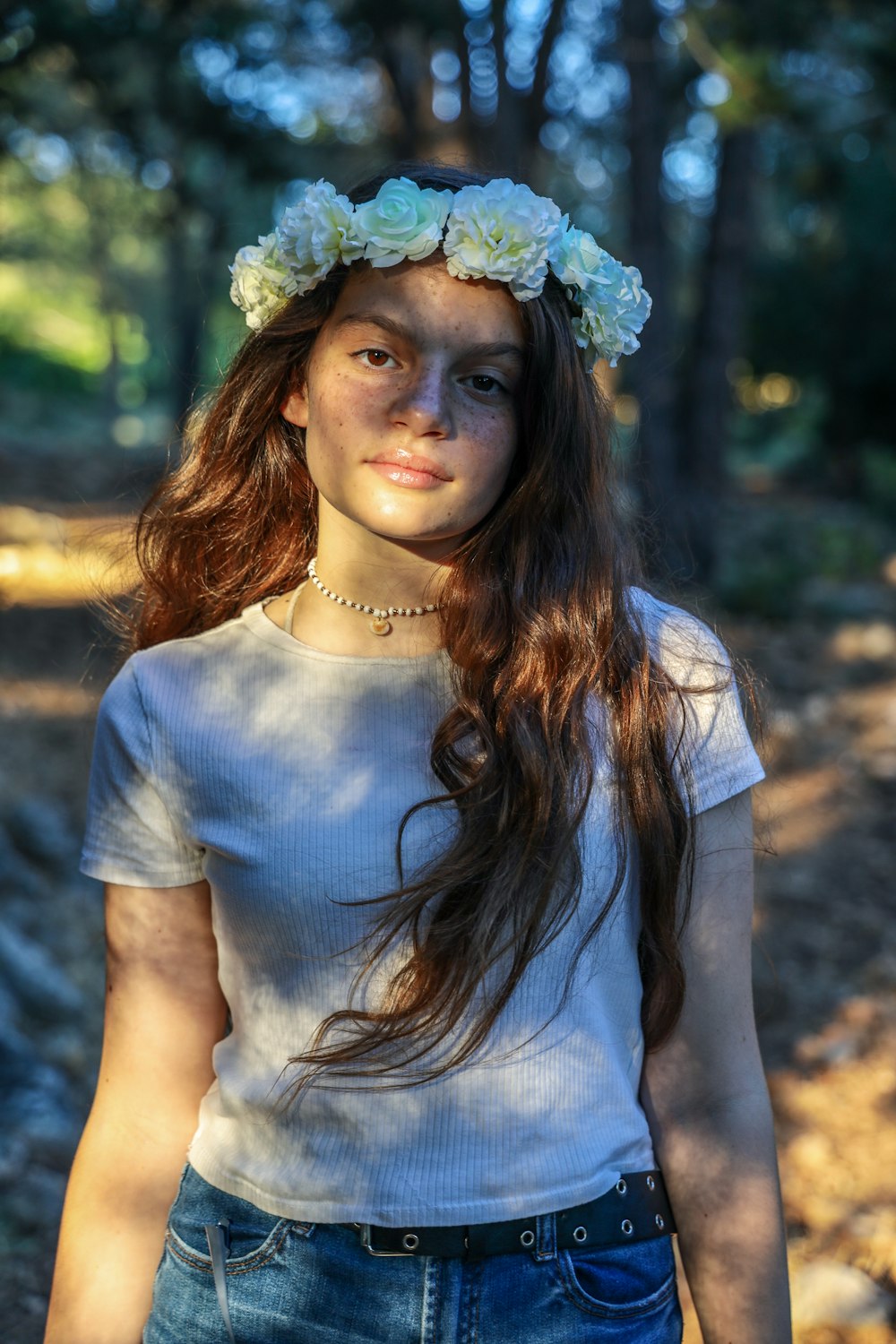 woman in blue crew neck shirt wearing green floral headband