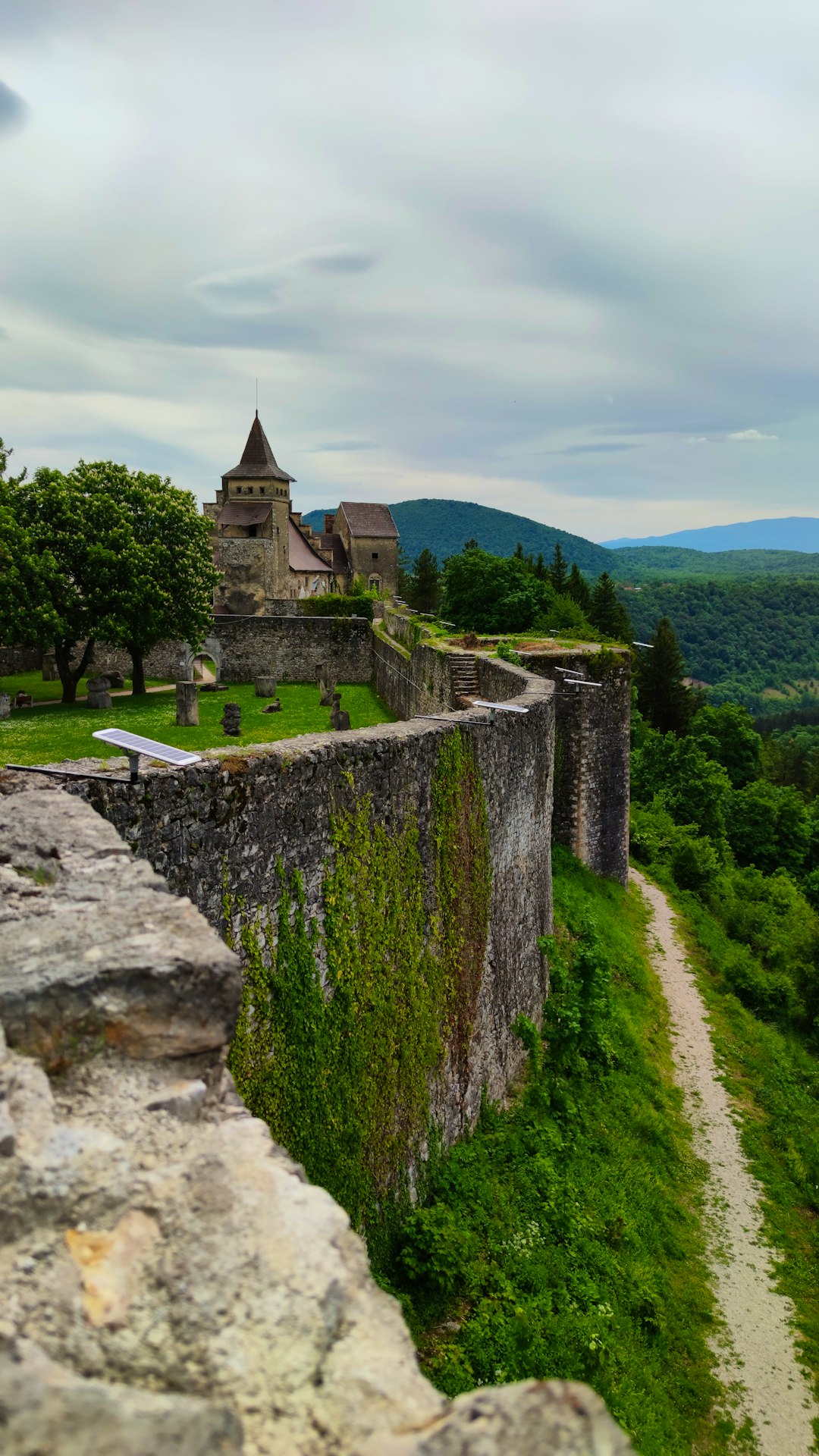 gray concrete castle on green grass field during daytime