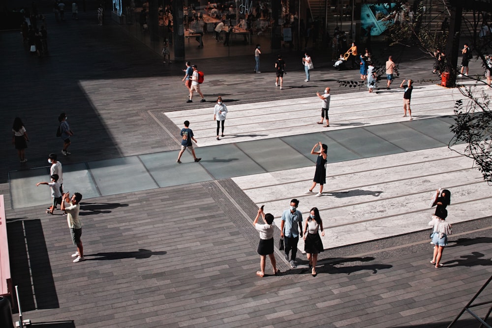 people playing basketball on court during daytime