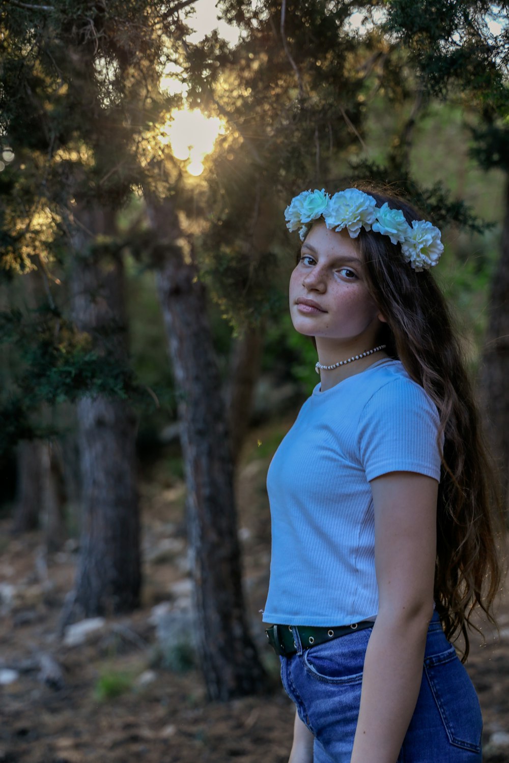 woman in blue crew neck t-shirt and white floral headband