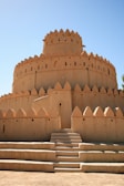 A fortified shelter with sandbags and wooden barriers protecting the entrance.
