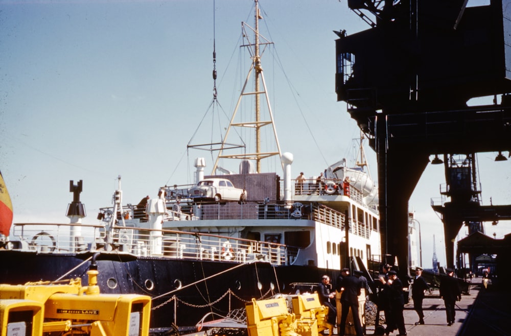 white and black ship on dock during daytime