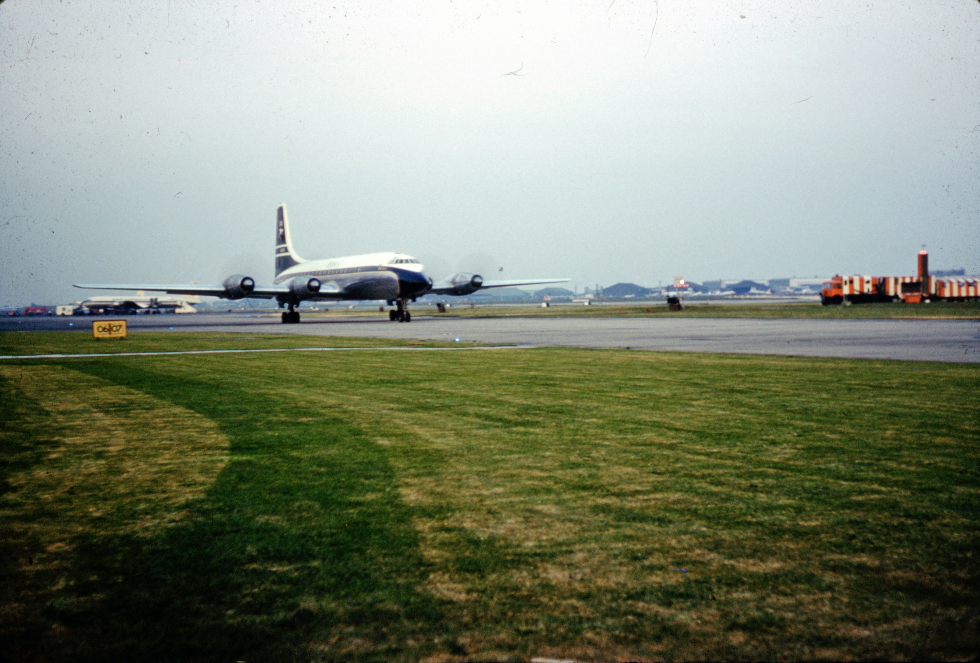 white passenger plane on green grass field during daytime, old photo, old photograph, digitised slides, scanned photographs, 1950s, 1960s, 50s, 60s, vintage, UK, england,