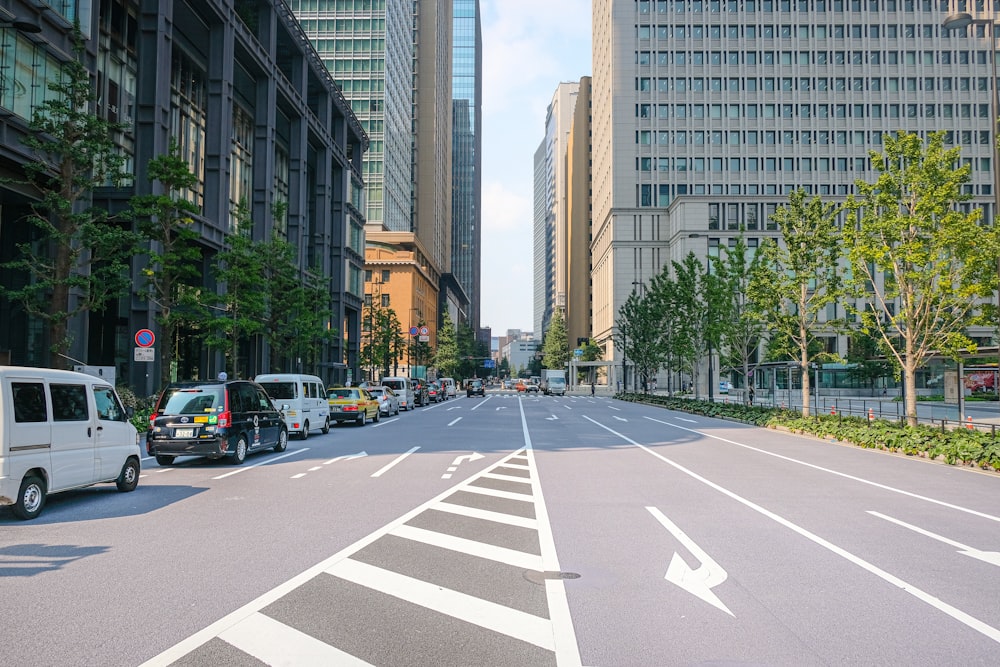 cars parked on the side of the road in the city during daytime