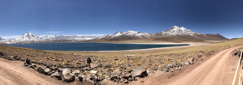 white and black mountains near body of water during daytime