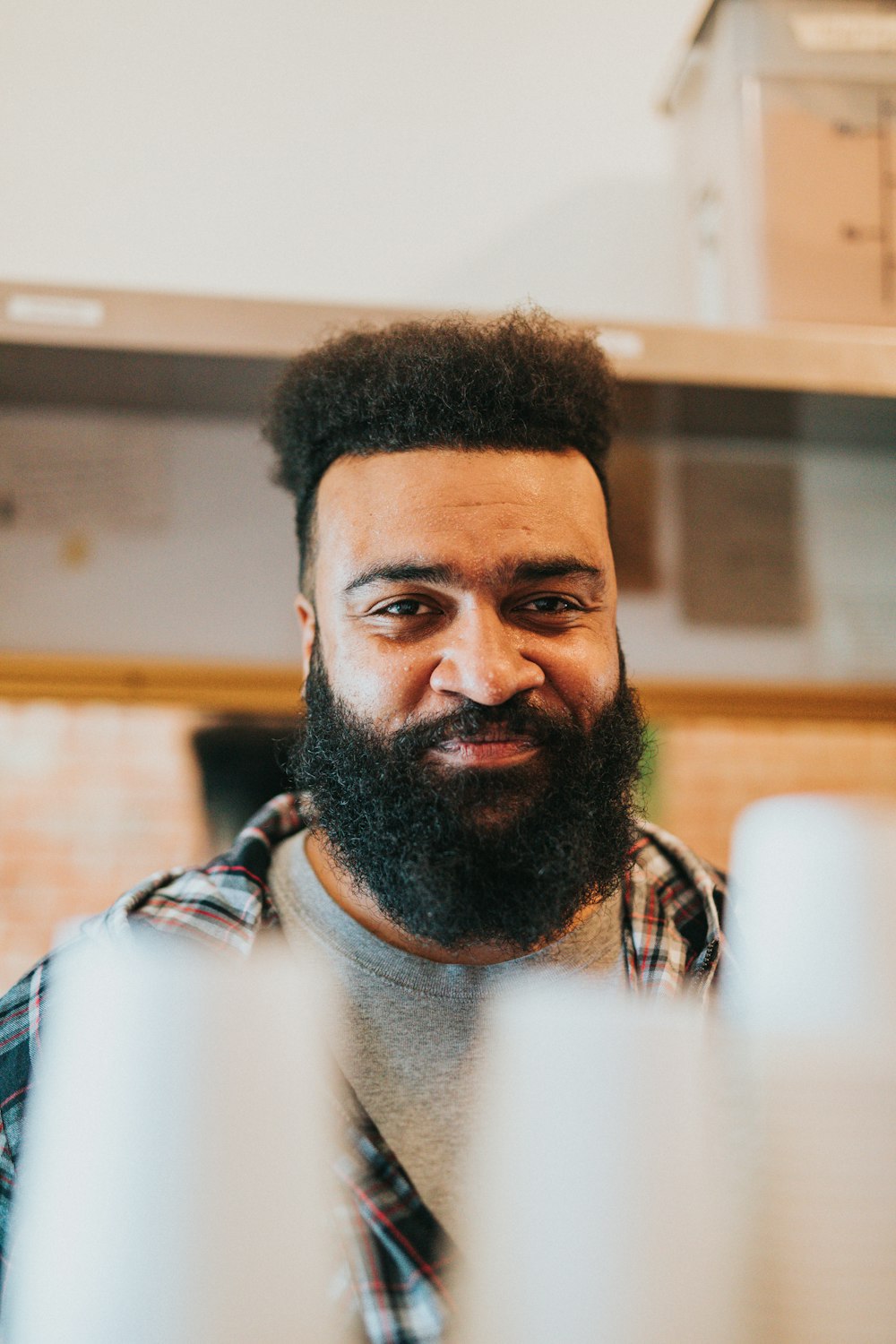 man in blue and white plaid shirt