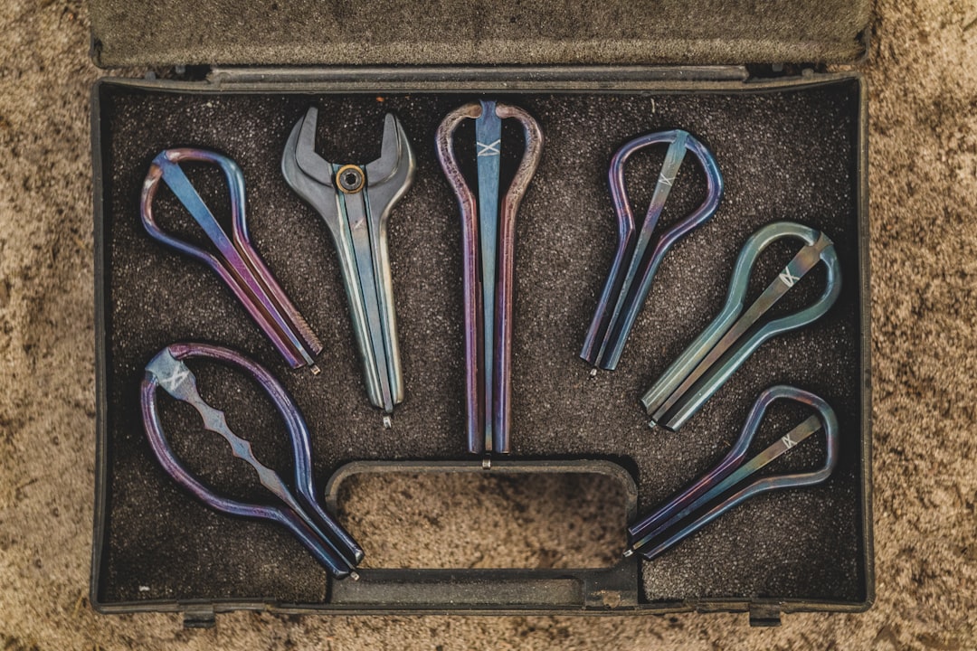 red and silver scissors on brown tray