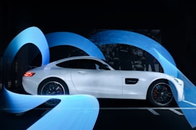 white coupe in a tunnel