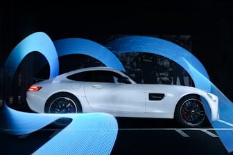 white coupe in a tunnel
