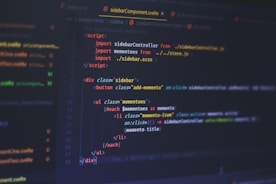A computer screen displays code written in a text editor. The code is related to web development and includes HTML and JavaScript. The interface shows a dark theme with syntax highlighting, featuring different colors for commands, variables, and elements. Some parts of the screen show filenames and directories on the left.