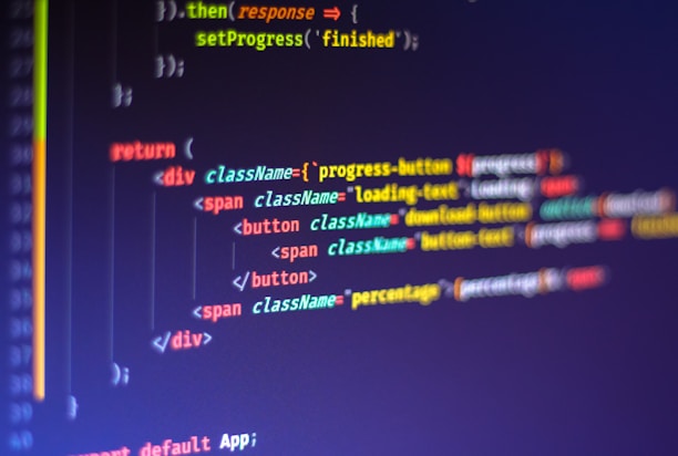 Computer code displayed on a monitor, featuring syntax highlighting. The code appears to be written in JavaScript, with HTML elements indicating a part of a web application. Various tags, class names, and functions are visible, emphasizing a focus on front-end development.
