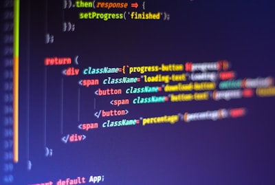 Computer code displayed on a monitor, featuring syntax highlighting. The code appears to be written in JavaScript, with HTML elements indicating a part of a web application. Various tags, class names, and functions are visible, emphasizing a focus on front-end development.