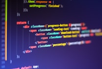 Computer code displayed on a monitor, featuring syntax highlighting. The code appears to be written in JavaScript, with HTML elements indicating a part of a web application. Various tags, class names, and functions are visible, emphasizing a focus on front-end development.