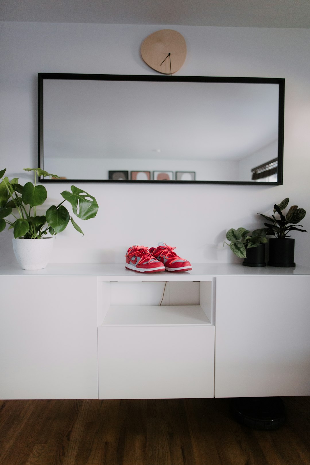 red roses on white wooden shelf