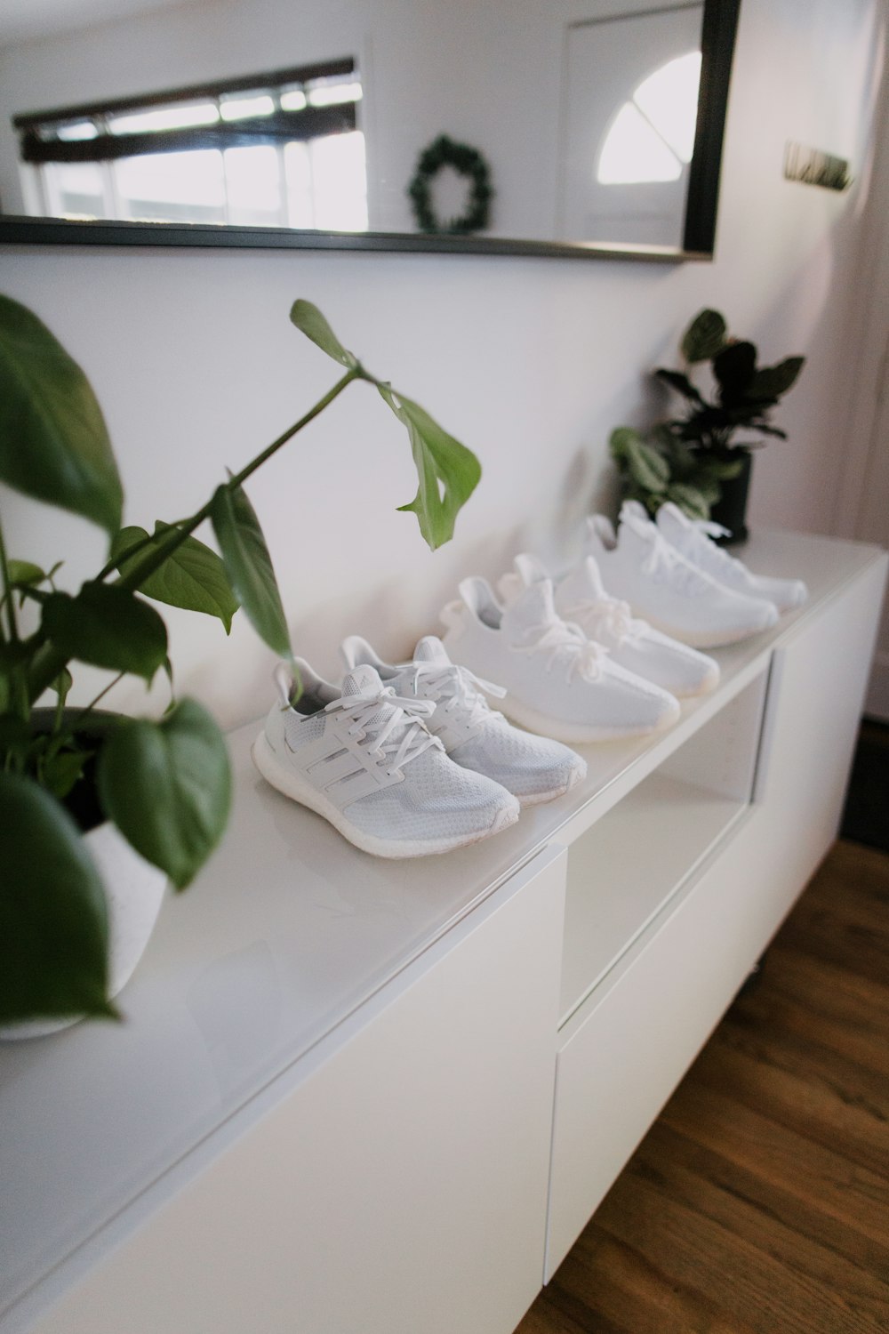 white nike air force 1 shoes on white wooden table