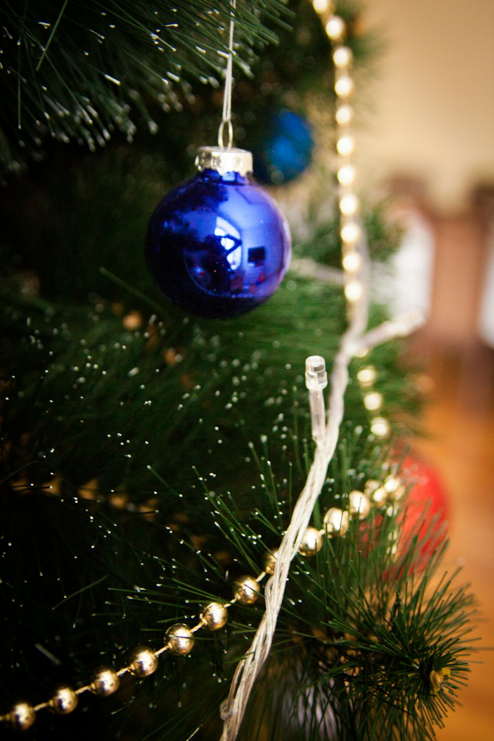 blue bauble on green christmas tree
