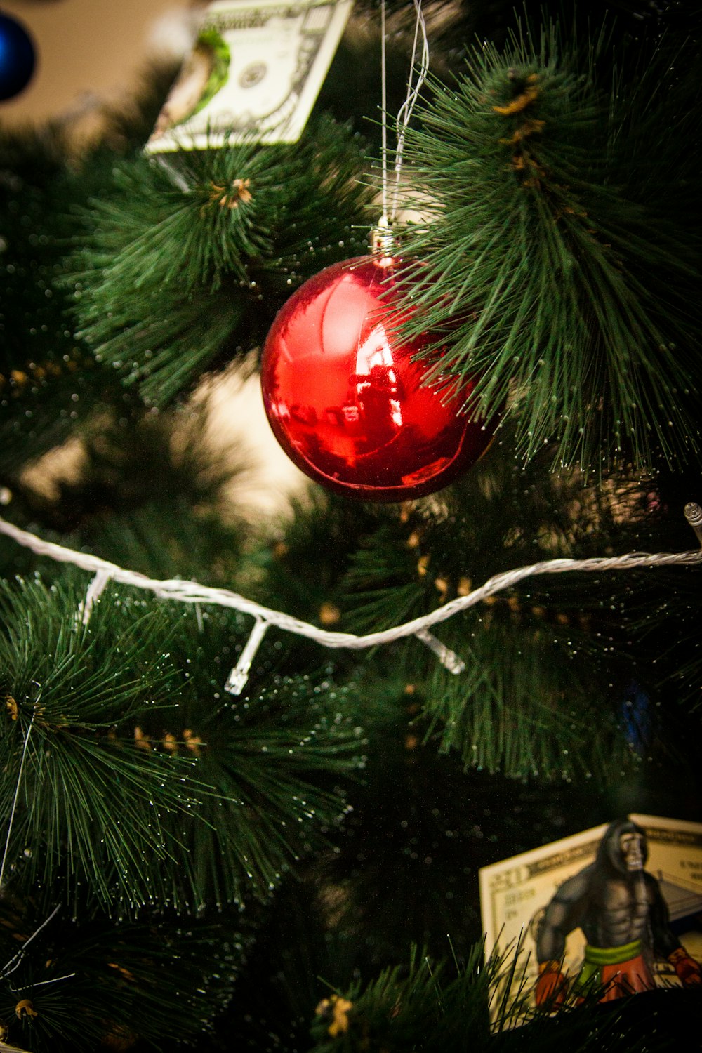 red bauble on green christmas tree