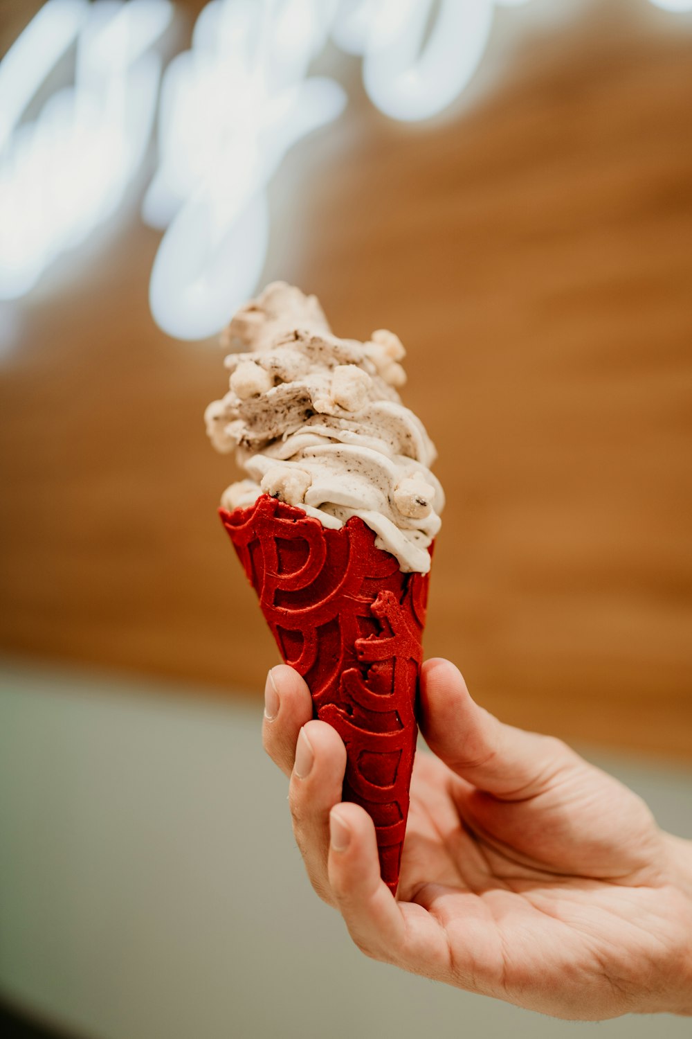 person holding ice cream cone