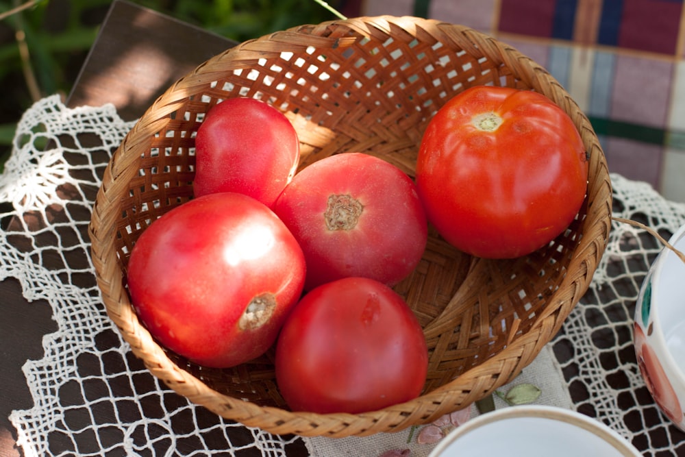 red apples on brown woven basket