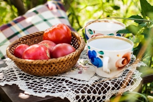 red apples on brown woven basket