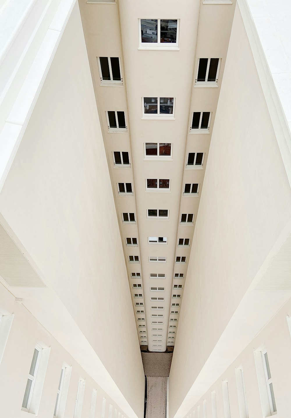 white concrete building with white ceiling