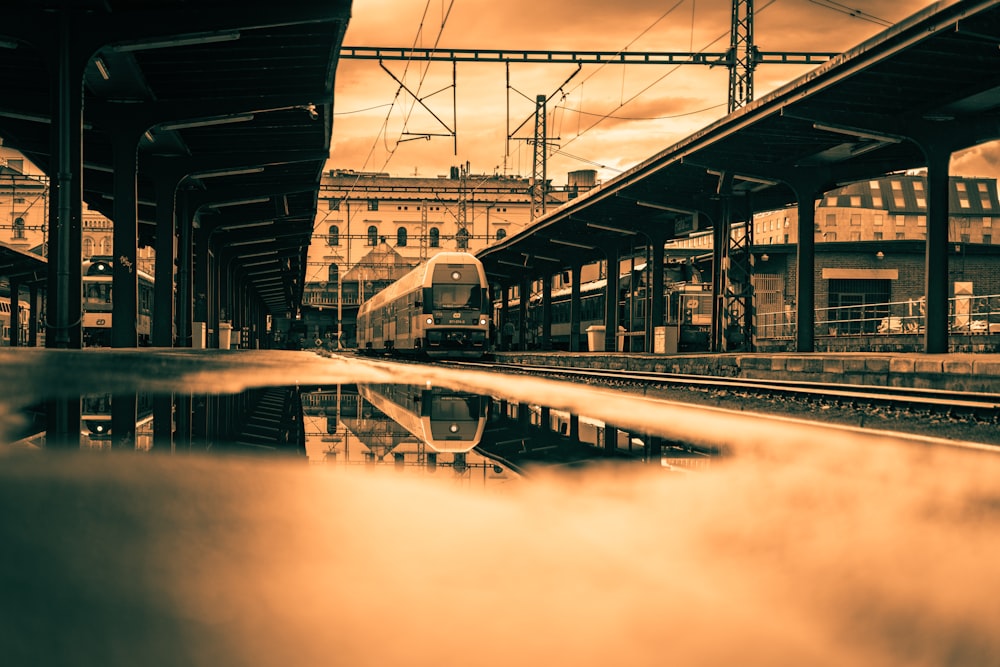 train on rail tracks during daytime