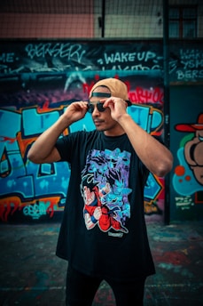 man in black and red floral t-shirt wearing black sunglasses