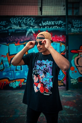man in black and red floral t-shirt wearing black sunglasses
