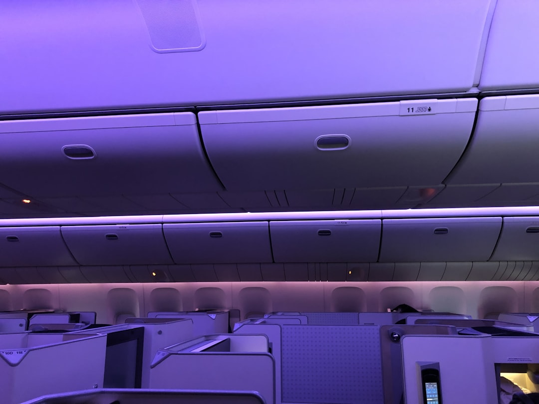 white and gray airplane seats, Japan Airlines Business Class Mood Lighting