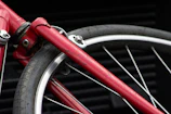 Close-up of a worn bicycle wheel covered in dust from the journey