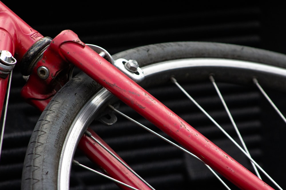 red bicycle wheel in close up photography