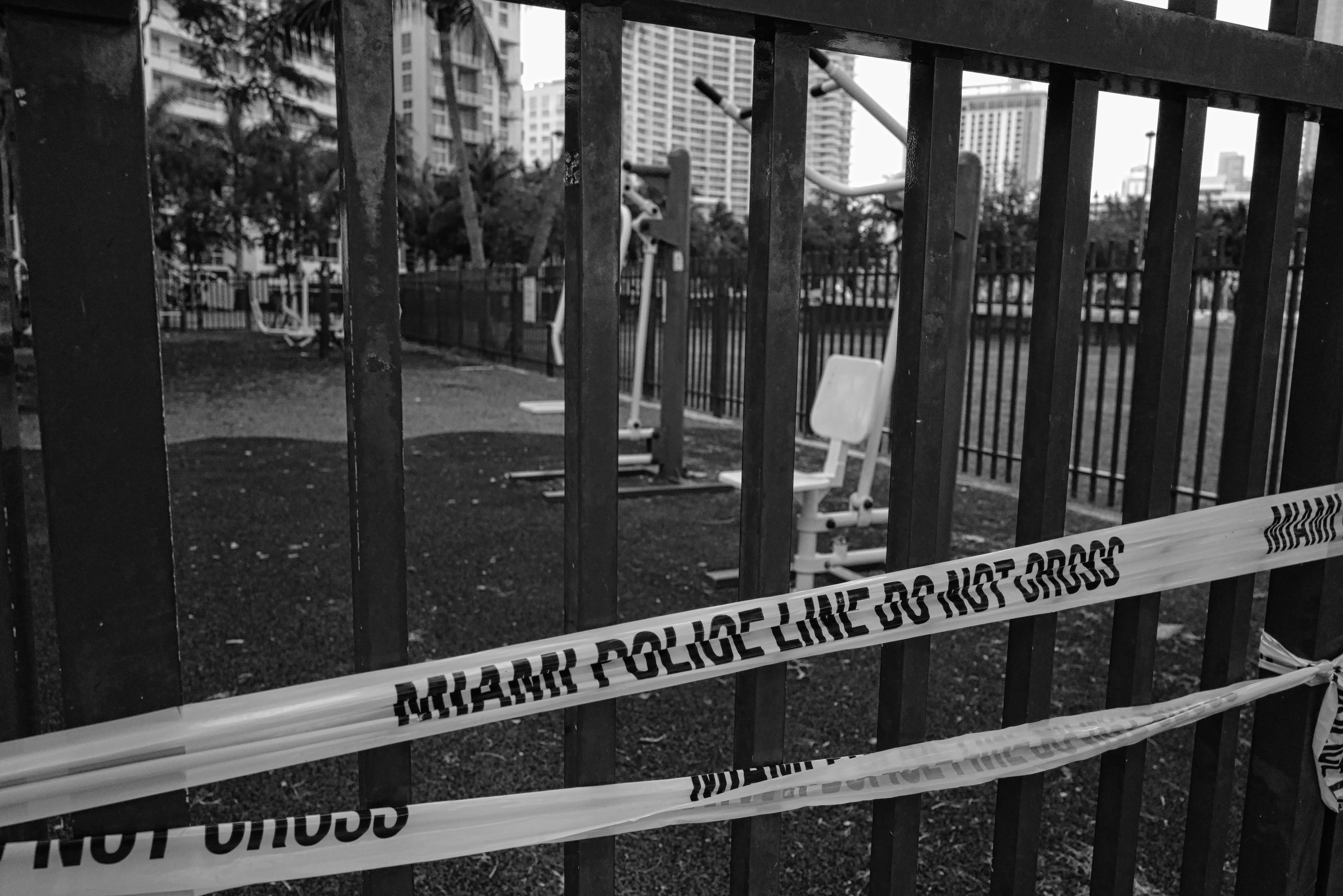 grayscale photo of wooden fence