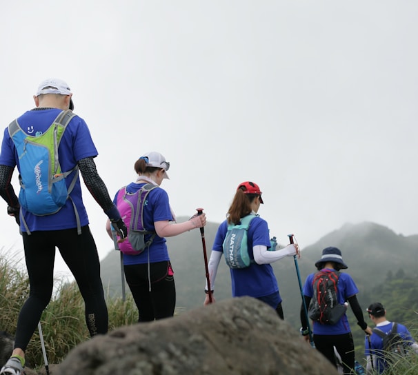 people standing on rock during daytime