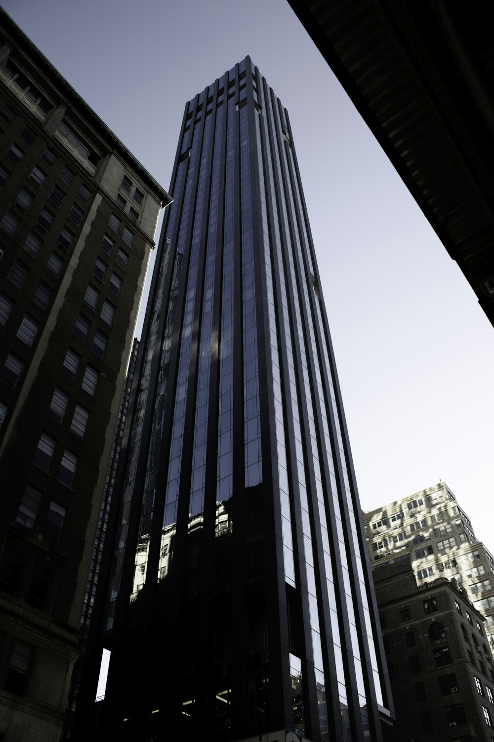 blue glass walled high rise building