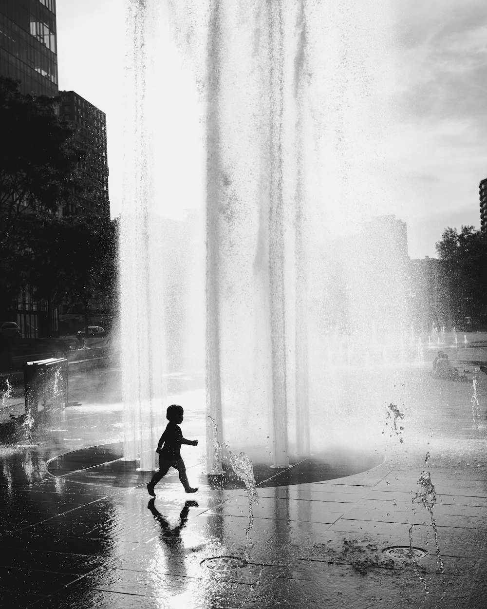 silhouette of person walking on street during daytime